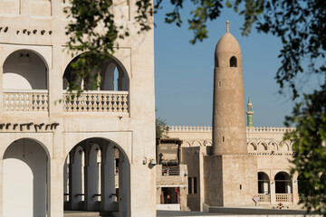 Fototapeta na wymiar Doha, Qatar, May,6,2019, Traditional Arabian mosque with minarets in old market Souk Waqif.