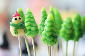 Luk Chub, a Thai dessert made from bean paste and agar adapted from Portuguese dessert macipan, molded into the shape of a pine tree. house and snowman
