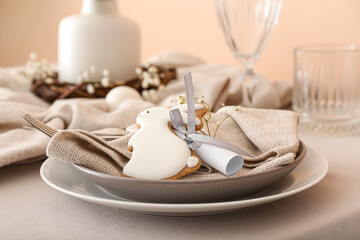 Dining table for Easter celebration with cookie in shape of bunny
