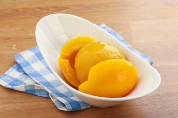 Sweet canned peaches with syrope