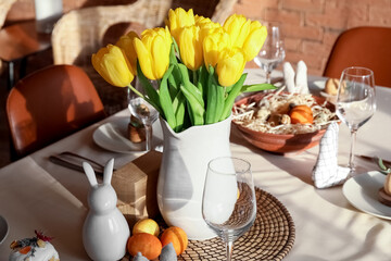Beautiful tulips on dining table served for Easter celebration