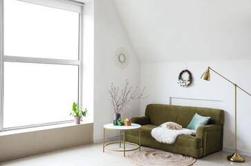 Interior of light stylish room decorated for Easter celebration