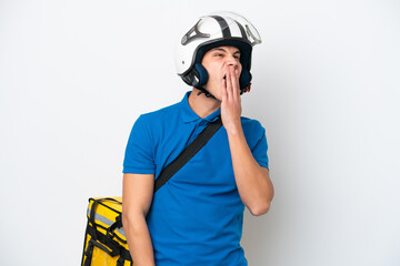 Young caucasian man with thermal backpack isolated on white background yawning and covering wide open mouth with hand