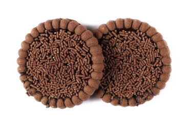 Cocoa biscuit with orange jelly and chocolate sprinkles isolated on white, top view