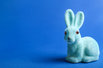 Cute soft Easter bunny on blue background