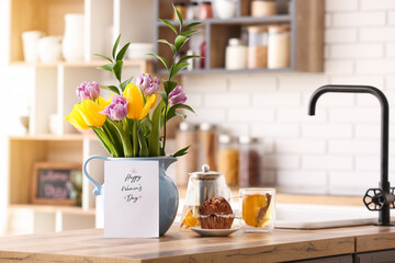Beautiful tulips, breakfast and greeting card with text HAPPY WOMEN'S DAY on kitchen counter