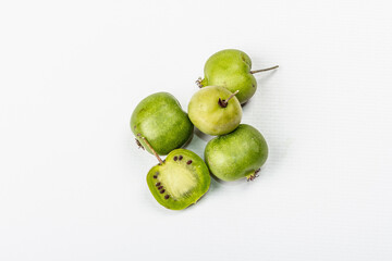 Ripe Actinidia arguta or kiwi isolated on white background