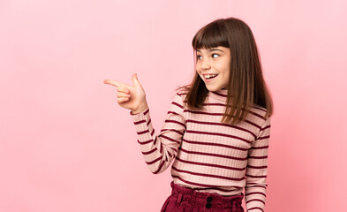 Little girl isolated on pink background intending to realizes the solution while lifting a finger up