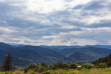 Fototapeta premium Beautiful panoramic views of the Carpathian Mountains from Uzhotsky pass high peak mountain in Ukrainian Carpathians Mountains. Near Mountain railway