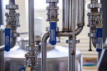 Large group of green recycled glass wine bottles at winery