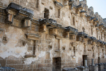 The Walls Of The Old Amphitheater remember a lot. Ancient reliefs on the stone walls.