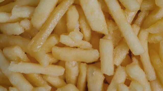 Top view: Chak Chak - fried crunchy honey cake on rotating surface - close up. Traditional Tatar and Bashkir cuisine, oriental dessert, gastronomy, pastry, food and Tatarstan national sweet concept