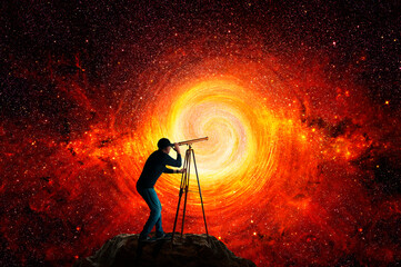 Man looking at the stars through a telescope