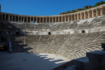 Ancient Roman amphitheater of Aspendos near Antalya. Historical destinations concept. blue sky
