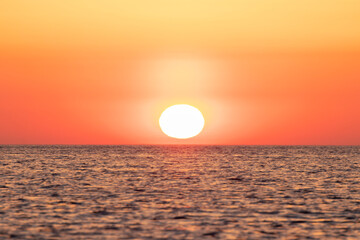 Fototapeta na wymiar sun rising at dawn over the mediterranean sea on the costa brava