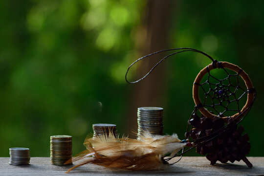 still life coins tower and dreamcatcher,save monney concept.