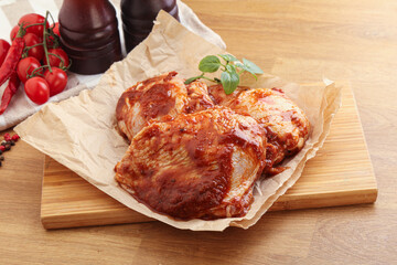 Marinated chicken leg in tomato sauce