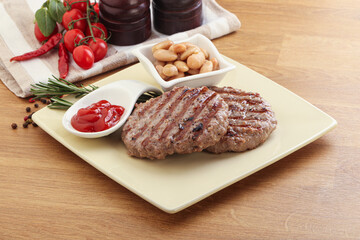 Grilled beef burger cutlet with sauce