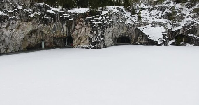 Snow-frozen marble caves in Ruskeala National Park in Russia. Marble Grotto