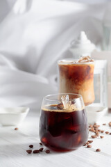 Iced coffee on a white wooden table.