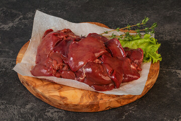 Raw chicken liver over board