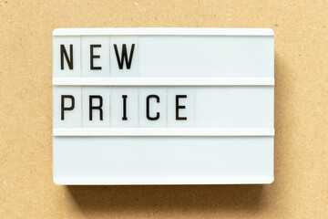 Lightbox with word new price on wood background