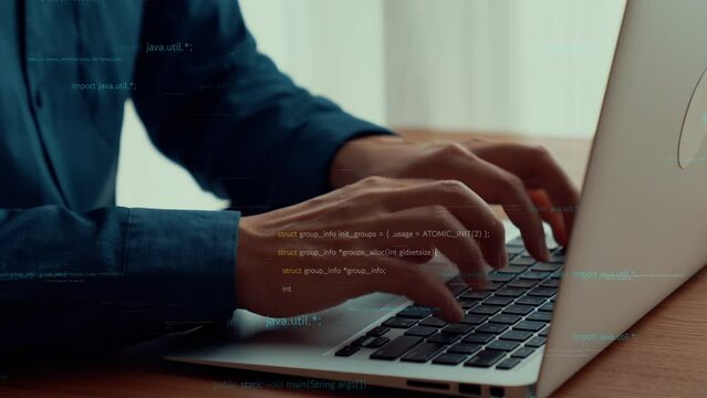 Computer programmer uses capable laptop computer to develop programming code of new software . Computer specialist working on future coding application for software programming development .