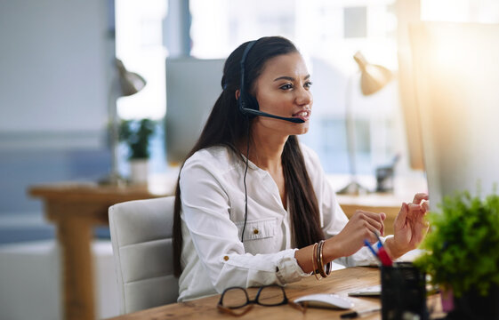 Eager to assist. Shot of a female agent working in a call centre.