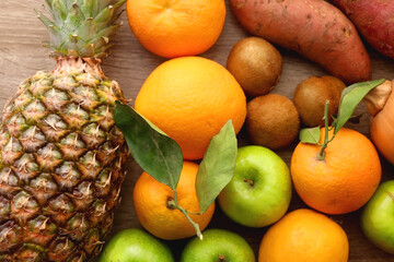 Various healthy fruit and vegetable on wooden background. Top view.