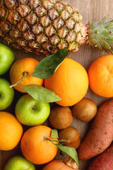 Various healthy fruit and vegetable on wooden background. Top view.