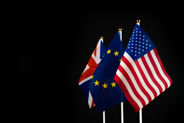 USA, Europe and United Kingdom flag. Conflict, world crisis and war concept. Sanctions pressure in politics. Black background photo