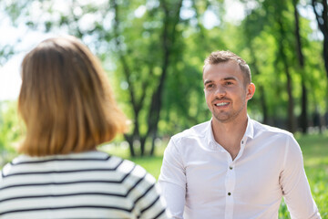 Fototapeta premium Couple with a dog in the park