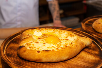 Khachapuri is a dish of Georgian cuisine, a Georgian national flour product, a pie stuffed with cheese and eggs. Caucasian cuisine.