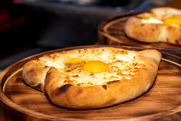 Khachapuri is a dish of Georgian cuisine, a Georgian national flour product, a pie stuffed with cheese and eggs. Caucasian cuisine.