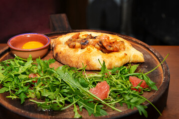 Khachapuri is a dish of Georgian cuisine, a Georgian national flour product, a pie stuffed with cheese and eggs. Caucasian cuisine.