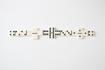 Vintage domino on white background. Close up, flat lay, top view, copy space.