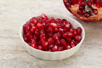 Ripe red Pomegranate seeds in the bowl