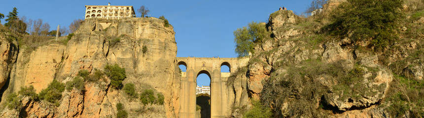 Fototapeta na wymiar View at the old bridge of Ronda on Andalusia, Spain