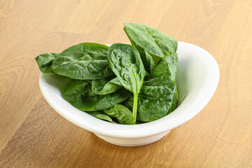 Fresh green spinach leaves in the bowl