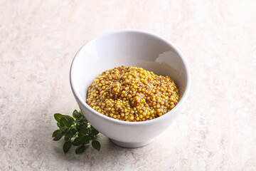 Grain mustard sauce in the bowl