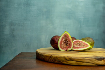 Fresh figs on a wooden table with copy space