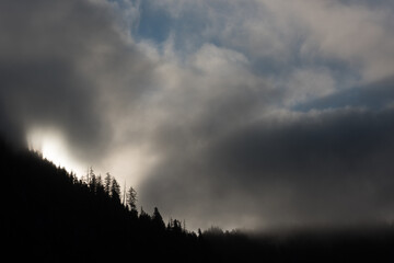 Cloudy, moody landscape of the mountains along the coast of southeast Alaska, USA.
