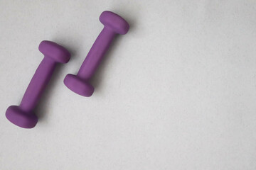 Dumbbells on a light background