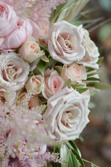 Wedding flowers, bridal bouquet closeup. Decoration made of roses, peonies and decorative plants, close-up, selective focus, nobody, objects. Wedding day.