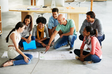 Fototapeta premium Theres no better work than teamwork. Shot of a group of casually dressed businesspeople in the office.