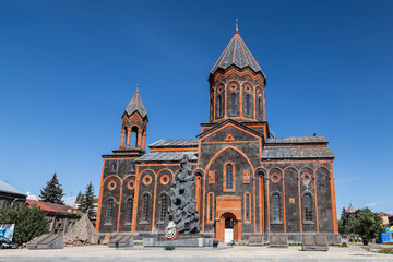Fototapeta na wymiar View of the Armenian Apostolic Church of the Holy Saviour and the monument to those killed in the devastating earthquake of 1988. Gyumri, Armenia