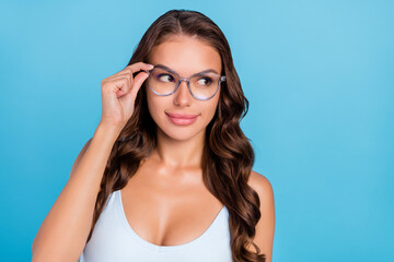 Photo of pretty lady ophthalmology clinic advertisement wear specs sportswear set isolated blue color background