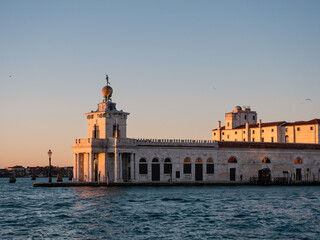 Fototapeta na wymiar Punta della Dogana or Dogana da Mar Building in Venice, Italy with Atlas Statues and Golden Globe