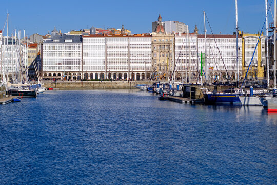Glass galleries and view of the port of La Coruna, Galicia, Spain