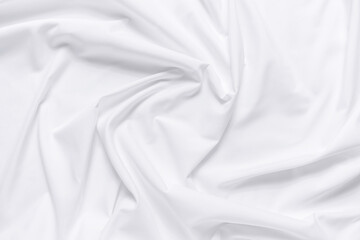 White fabric texture background. Cloth soft wave. Creases of satin, silk, and cotton.